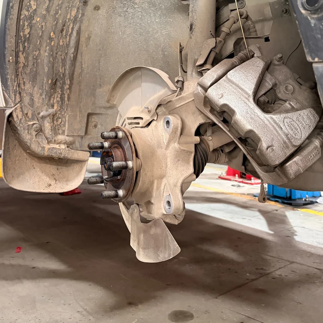 Brake repair before state showing hub and suspension components