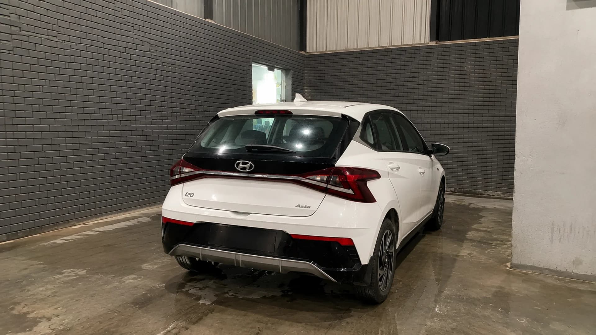 White car in the washing bay at THE CAR O CARE