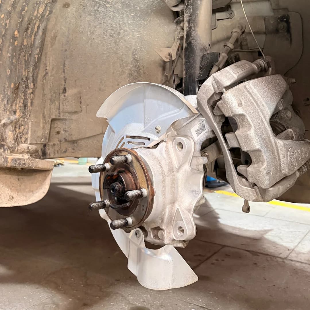 Brake hub repair and suspension inspection at THE CAR O CARE Noida workshop
